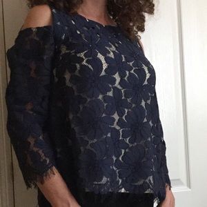 Navy blue top.  Has cut out sleeves.